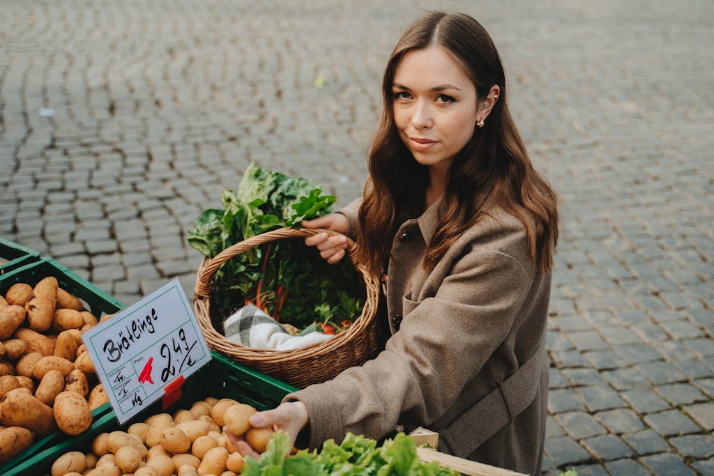 A Woman in Brown Jacket at the farmers market